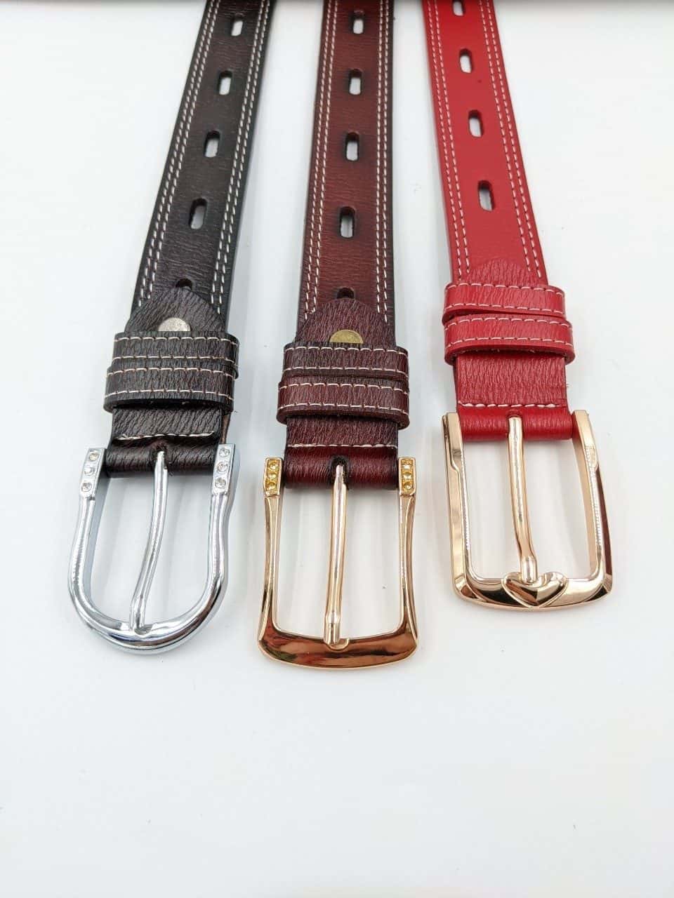 Three slim stitched belts in dark brown, burgundy and red