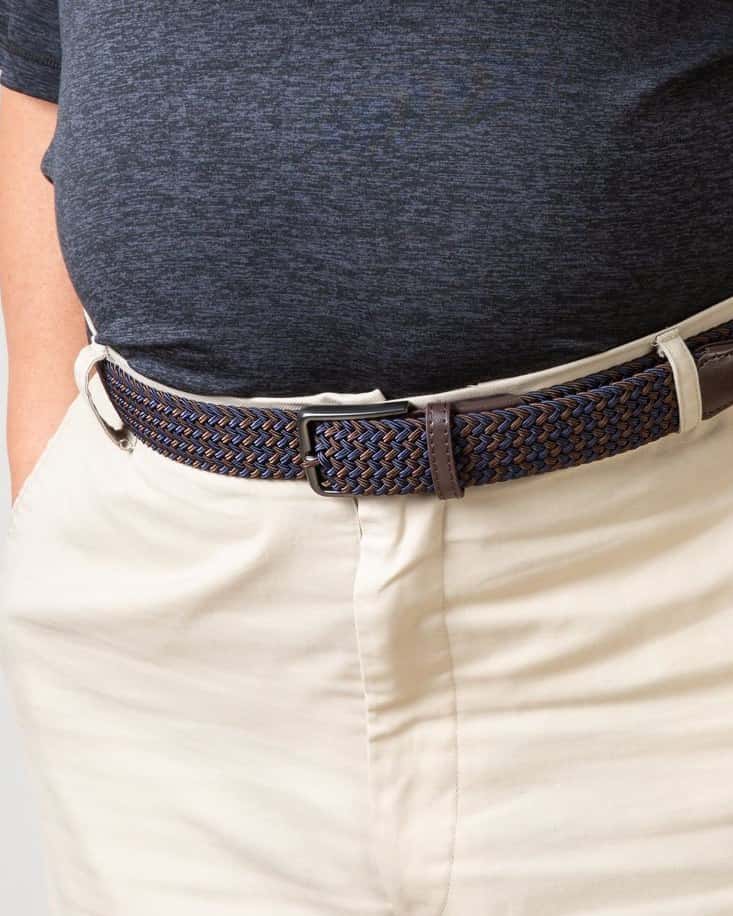 A big & tall man wearing a braided stretch belt with a pin buckle