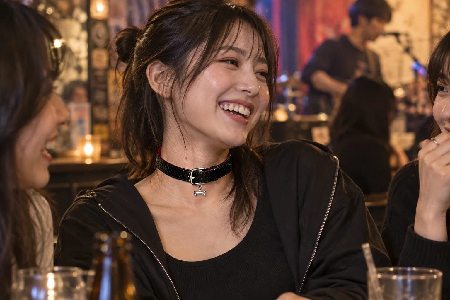 A woman laughing with friends in a bar, wearing a black leather choker