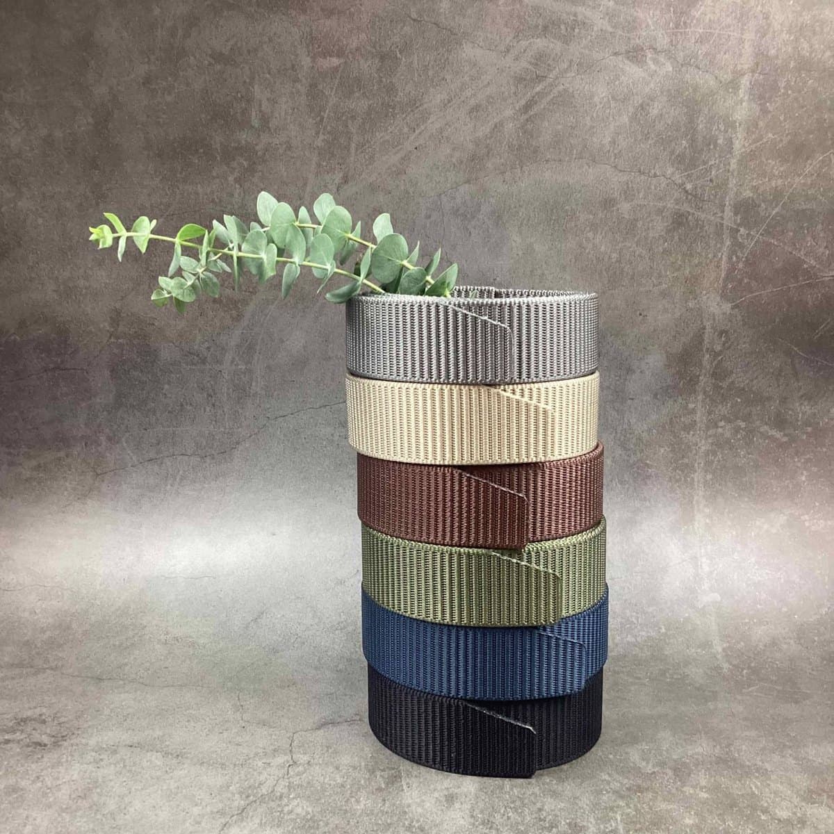 Nylon webbing straps in six colours, stacked: grey, sand, brown, olive, navy and black