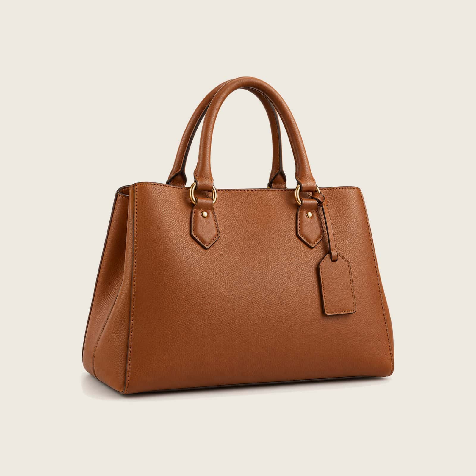 Cognac pebble-grain leather women's tote with two rolled handles and a leather hang tag